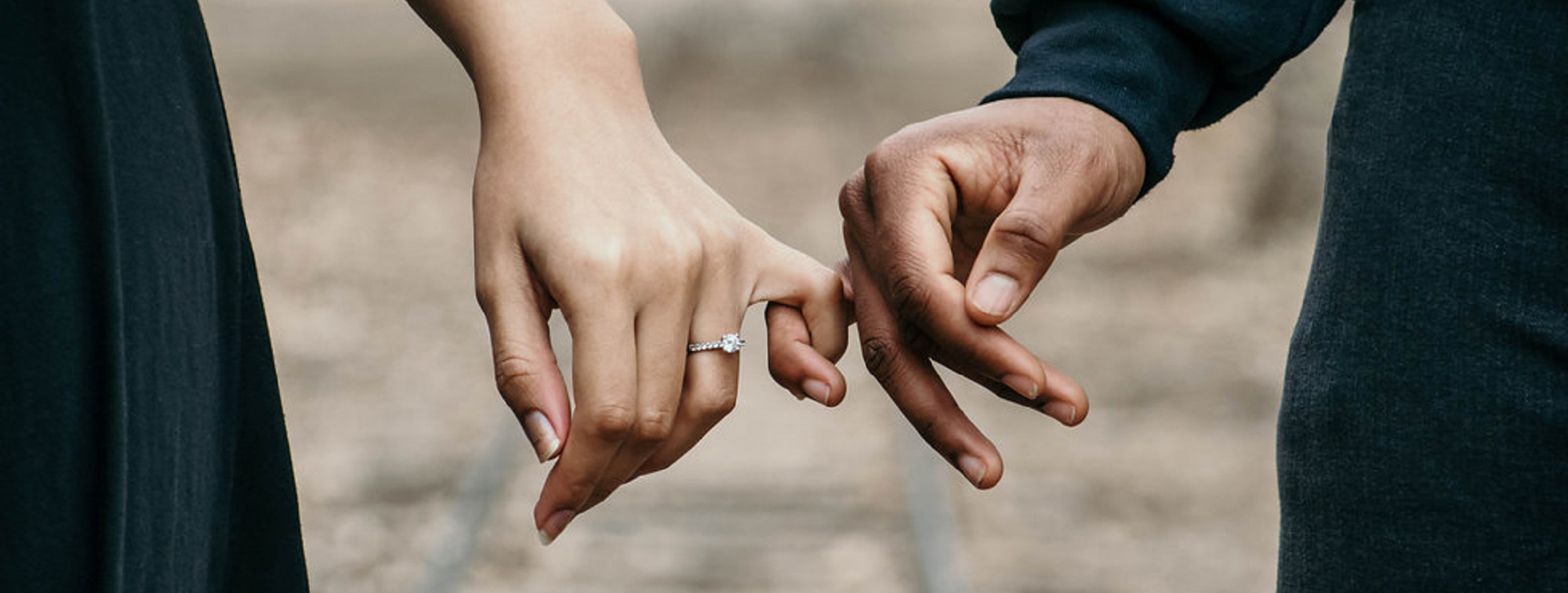 Couple holding hands on a date.